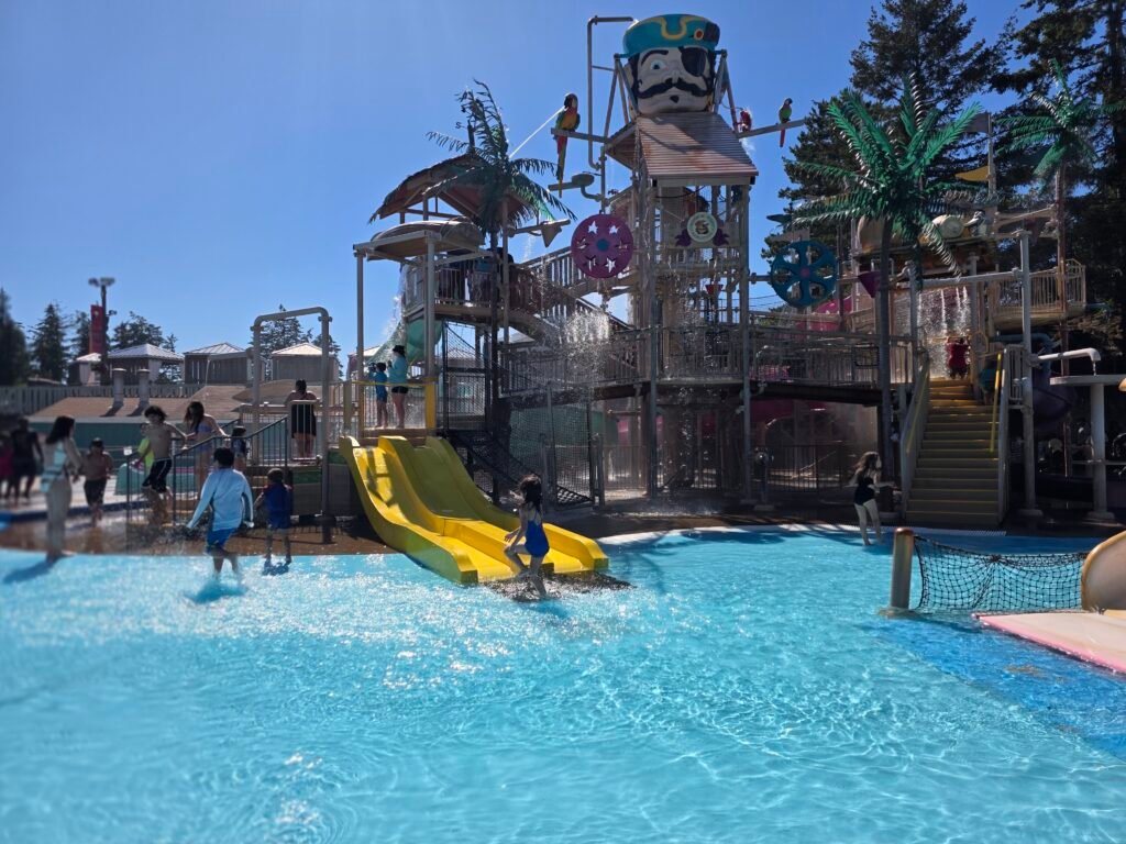 Children playing in the pirate-themed splash zone at Wild Waves in Federal Way